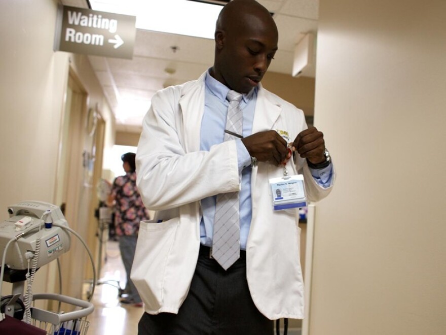 Ngabo Nzigira is being trained by a doctor at Kaiser Permanente in South Sacramento. Normally he wouldn’t be in a clinic until his third year, but in just his sixth week of an accelerated program at UC Davis, he's interacting with patients.