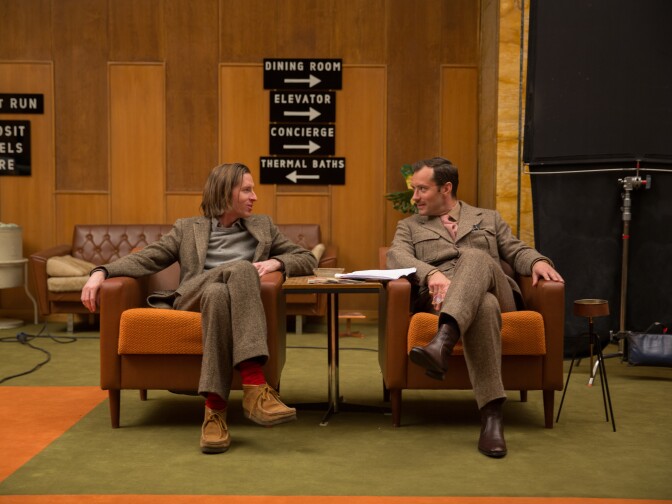 Director Wes Anderson and actor Jude Law talk on set of "The Grand Budapest Hotel."