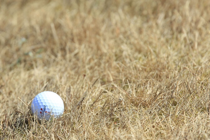 File: A ball comes to rest in the sun parched grass during the second round of the Van Lanschot Senior Open played at Koninklijke Haagsche Golf and Country Club on July 10, 2010 in The Hague, Netherlands.