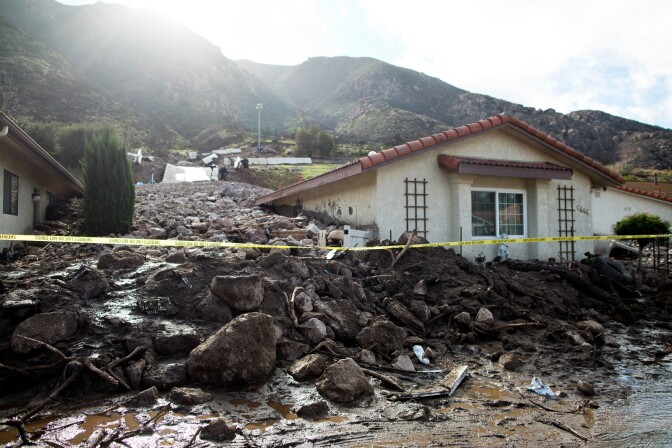 A home damaged by mudslides on Nov. 1 was further buried after an overnight storm caused mudslides in Camarillo Springs on Friday afternoon, Dec. 12, 2014.