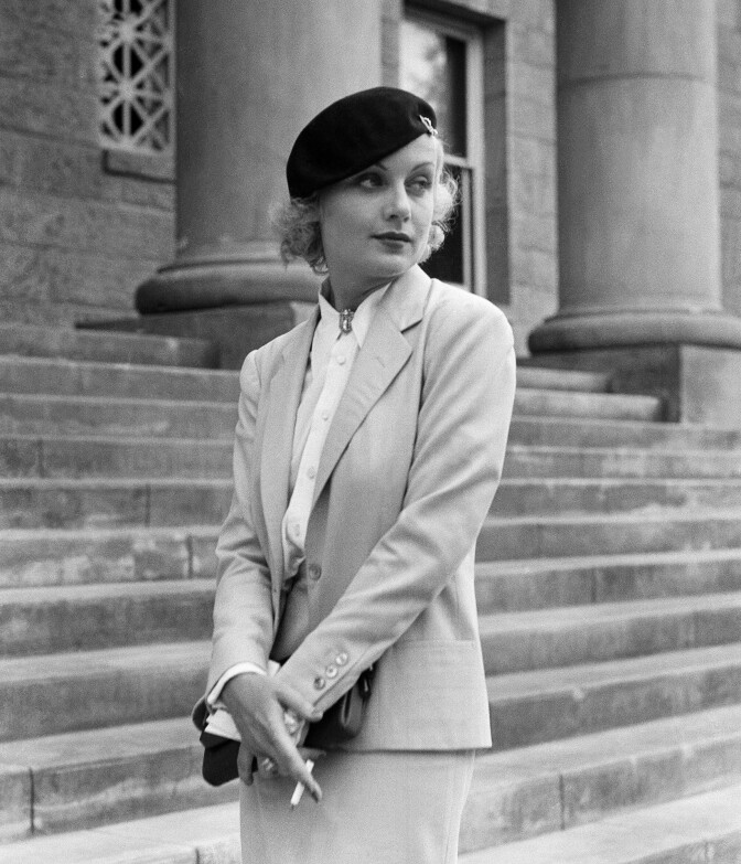 In this Aug. 18, 1933, file photo, Carole Lombard, well known screen actress shown on the courthouse steps at Carson City, Nev., following her divorce from her husband, William Powell. 