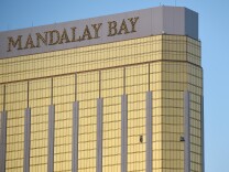 Broken windows are seen on the 32nd floor of the Mandalay Bay Resort and Casino after a lone gunman opened fired on the Route 91 Harvest country music festival on Oct. 2, 2017 in Las Vegas, Nevada. The gunman, identified as Stephen Paddock, 64, of Mesquite, Nevada, opened fire from the Mandalay Bay Resort and Casino on the music festival.