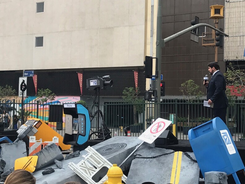 A crowd watched as the War of the Worlds performance began in a parking lot in downtown L.A. across the street from a decommissioned air raid siren. Set design by Calder Greenwood. Photo credit: Adriana Cargill