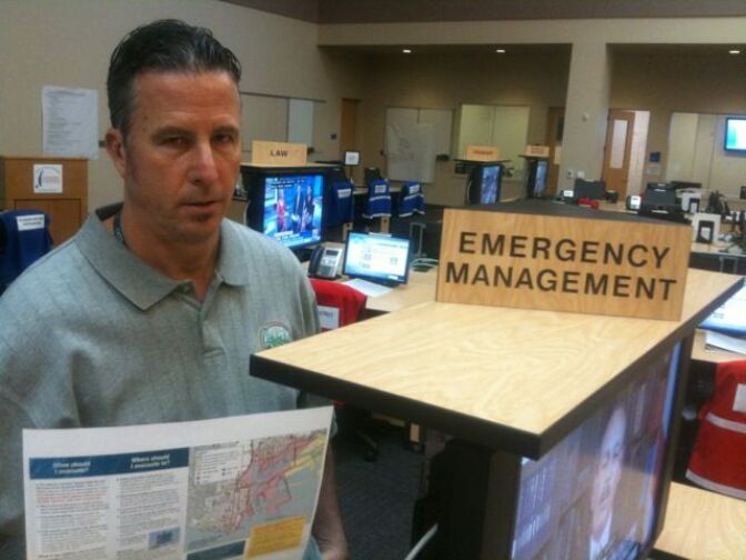 Chris Ipsen with a tsunami preparedness brochure at Los Angeles' Emergency Operations Center