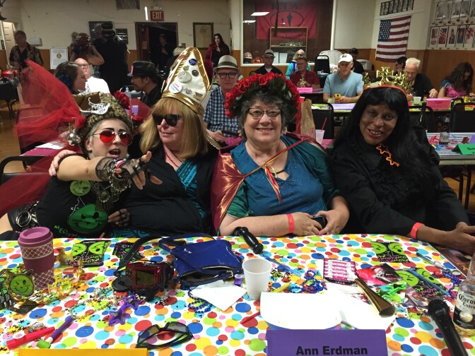 The judging table at the Doodah queen tryouts featuring city council members, small business owners, and opera singers.