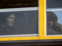 SAN BERNARDINO, CA - DECEMBER 2:  Employees and other people are evacuated by bus from the site of a mass shooting at the Inland Regional Center December 2, 2015 in San Bernardino, California. Multiple fatalities were reported as police search for up to 3 suspects who are still at large. (Photo by David McNew/Getty Images)