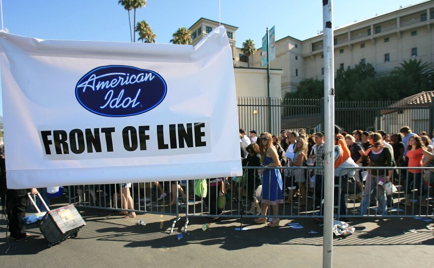 File: American Idol hopefuls wait in line for the open audition for American Idol Season 6 at the Rose Bowl on Aug. 8, 2006 in Pasadena.
