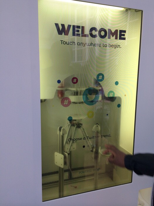 A touch screen with adjustable opacity controls the 3D printer.