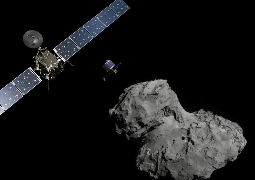 Rosetta mission poster showing the deployment of the Philae lander to comet 67P/Churyumov–Gerasimenko. (The image of the comet was taken with the navigation camera on Rosetta.)