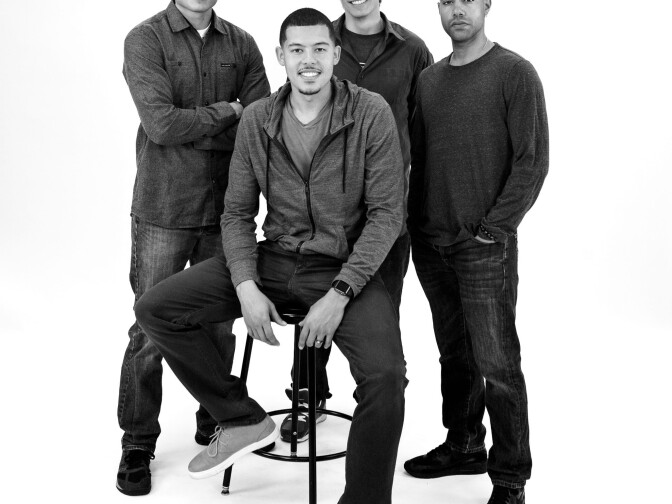 L-R: Peter Mendoza (“Elliot, A Soldier’s Fugue”), Elliot Ruiz, Peter Pasco (“The Happiest Song Plays Last”) and Sean Carvajal (“Water by the Spoonful”). Carvajal, Mendoza and Pasco all portray Ruiz in Quiara Alegría Hudes’ Elliot Trilogy, which will play at the Kirk Douglas Theatre, the Mark Taper Forum and the Los Angeles Theatre Center concurrently. Photo by Deanna McClure. 