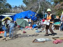 County workers clear and raze a homeless encampment beside the Santa Ana River on February 20, 2018 in Anaheim, California.
Officials in Orange County began moving homeless transients out of the homeless tent encampments to shelters or motels as part of the settlement worked out by homeless advocates and the county under supervision of a federal court judge. / AFP PHOTO / Frederic J. BROWN        (Photo credit should read FREDERIC J. BROWN/AFP/Getty Images)