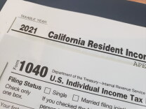 Close up of the tops of two tax returns