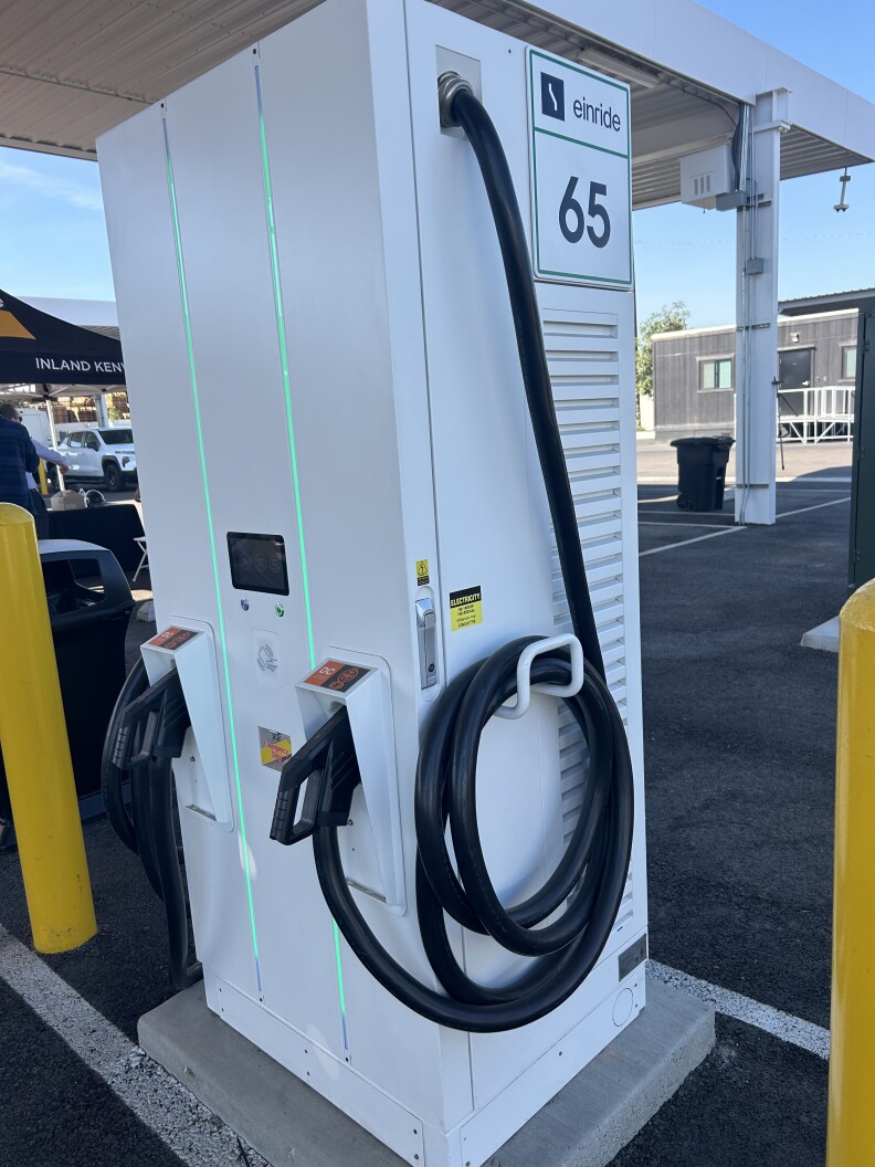 A white electric vehicle charger. 
