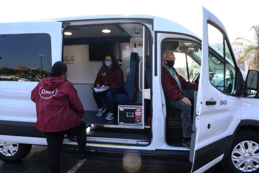 L.A. County Department of Mental Health workers board a Therapeutic Transport van.