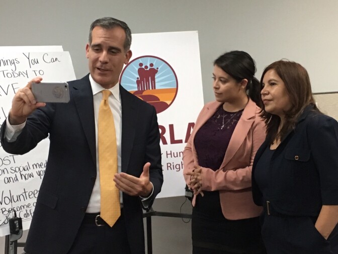 Los Angeles Mayor Eric Garcetti, left, with Deferred Action for Childhood Arrivals (DACA) recipient Melody Klingenfuss, center, and Coalition for Humane Immigrant Rights of Los Angeles executive director Angelica Salas, right. Garcetti visited the offices of CHIRLA on Tuesday, Aug. 29 to urge voters via Facebook Live to contact elected officials in support of DACA.
