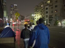 LOS ANGELES, CA - JANUARY 29:  Volunteers count homeless people on Skid Row during the 2015 Greater Los Angeles Homeless Count conducted by the Los Angeles Homeless Services Authority (LAHSA) on January 29, 2015 in Los Angeles, California. About 6,000 volunteers take part in counting the homeless people that they see as well as tents, cars and other structures used by the homeless, but avoid estimating the amount of people that might be inside such shelters. The last Greater Los Angeles Homeless Count, which took place in 2013, found that LA had one of the largest homeless populations in the country, with more than 39,000 men, women and children living on the streets. (Photo by David McNew/Getty Images)