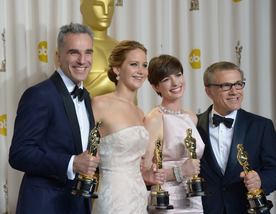 Best Actor Daniel Day-Lewis stands with Best Actress Jennifer Lawrence, Best Supporting Actress Anne Hathaway, and Best Supporting Actor Christoph Waltz during the 85th Academy Awards on February 24, 2013 in Hollywood, California.