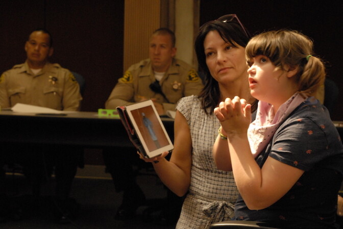 Bobbie Hendrickson brought her 14-year-old daughter Sydney to a Los Angeles County Sheriff’s Department seminar on interactions with the autistic. Sydney, who is autistic, sometimes relies on her computer tablet to communicate with her family. 