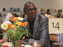 Artist Mark Bradford watches the program during the 2014 Santa Monica Museum of Art PRECOGNITO Gala on April 23, 2014, in Santa Monica, Calif. (Photo by Ryan Miller/Invision/AP)