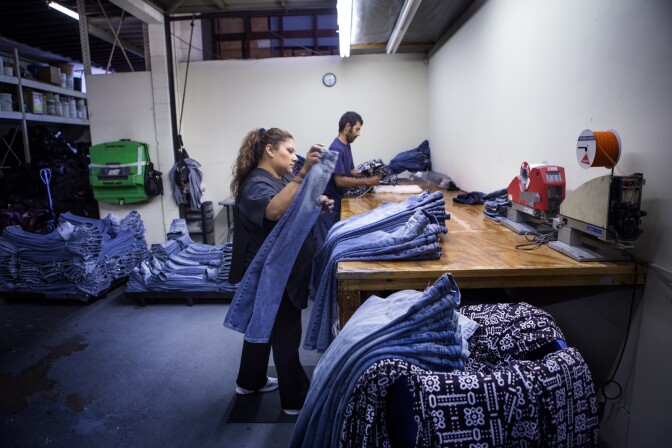 U.S. factories cut back sharply on production in April, as auto companies cranked out fewer cars and most other industries reduced output. The weakness in manufacturing suggests economy growth may be slowing this spring. The Federal Reserve said Wednesday that manufacturing output dropped 0.4 percent in April from March. (Photo: Workers inspect designer jeans at a factory in Lynnwood, Calif.)