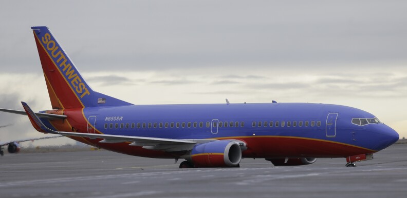A Southwest Airlines Boeing 737 taxis to a gate Tuesday, Jan. 26, 2016, at Seattle-Tacoma International Airport in Seattle. (AP Photo/Ted S. Warren)