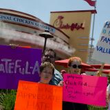 Familes as well as individuals attended. Here Gary Lucy, Jane Wilson, and son, Preston Lucy, all came to the protest. Fellow protester Kris McGaha joins them.