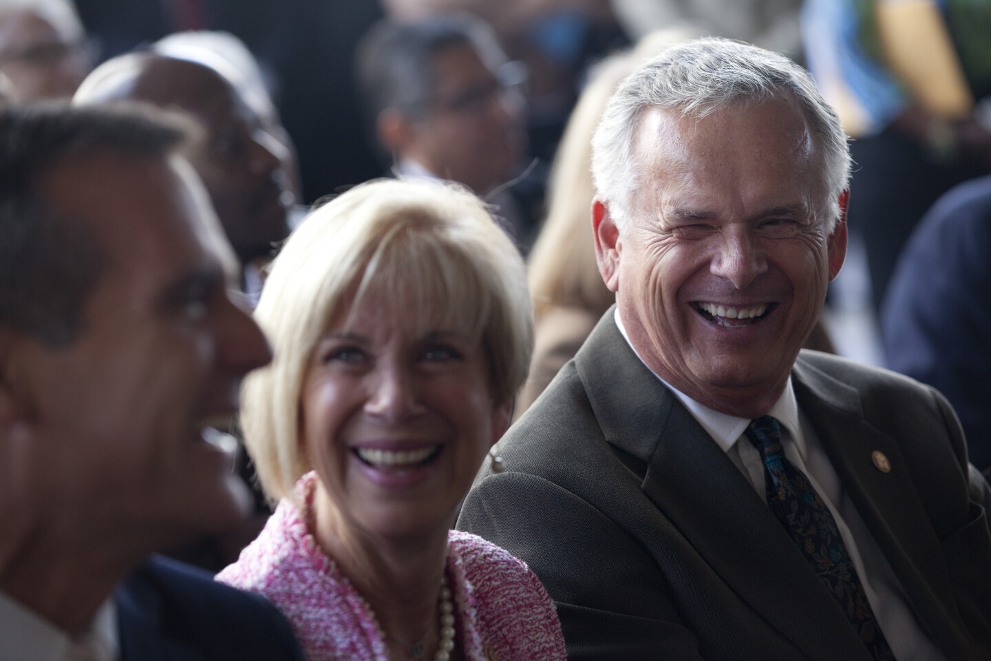 Mayor Eric Garcetti, left, Congresswoman Janice Hahn and her brother, Superior Court Judge James Hahn joke during the ceremony to name the City Hall East building after justice Hahn, who was the L.A. city controller, city attorney and mayor.