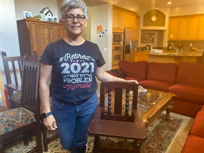 Norma Jasso, 62, sped up retirement plans after her daughter asked for help with a new baby. She stands with a highchair her father had commissioned from a shop in Sinaloa, Mexico. Her daughters used it and now her grandson will too.