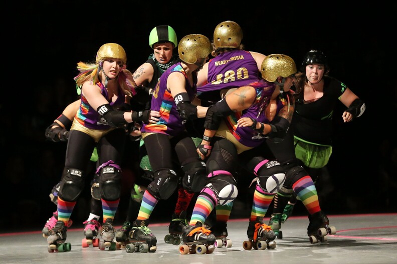 Competitors from Team Unicorn and the D'Viants compete during Bout One of the Sydney Roller Derby League on May 11, 2013 in Sydney, Australia. 