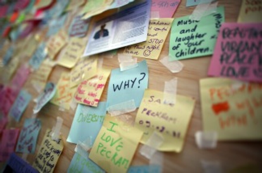 A boarded up window of a discount store in Peckham carries notes of peace on August 10, 2011 in London, England.