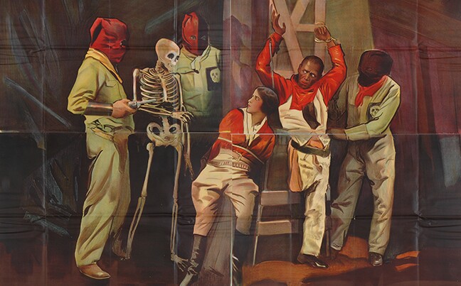 A painting depicts a woman wearing boots and riding breeches tied to a chair. 4 men, 3 of them wearing bags over their heads, stand around her along with a skeleton.