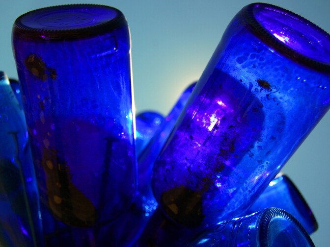 Blue bottles catch the Mojave Desert sunlight at Bottle Tree Ranch.