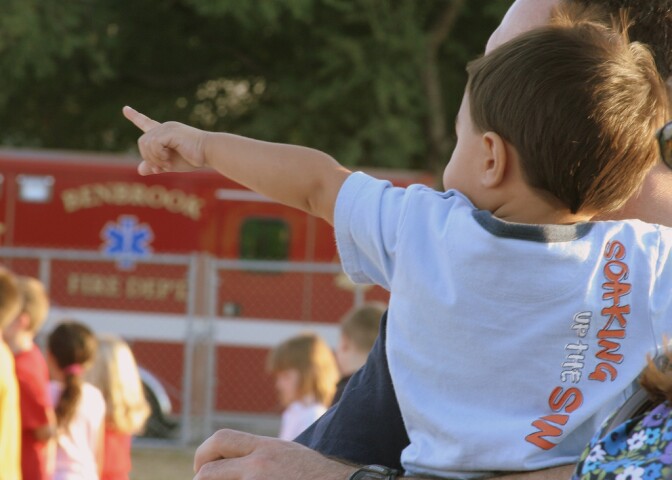 Young child pointing. 