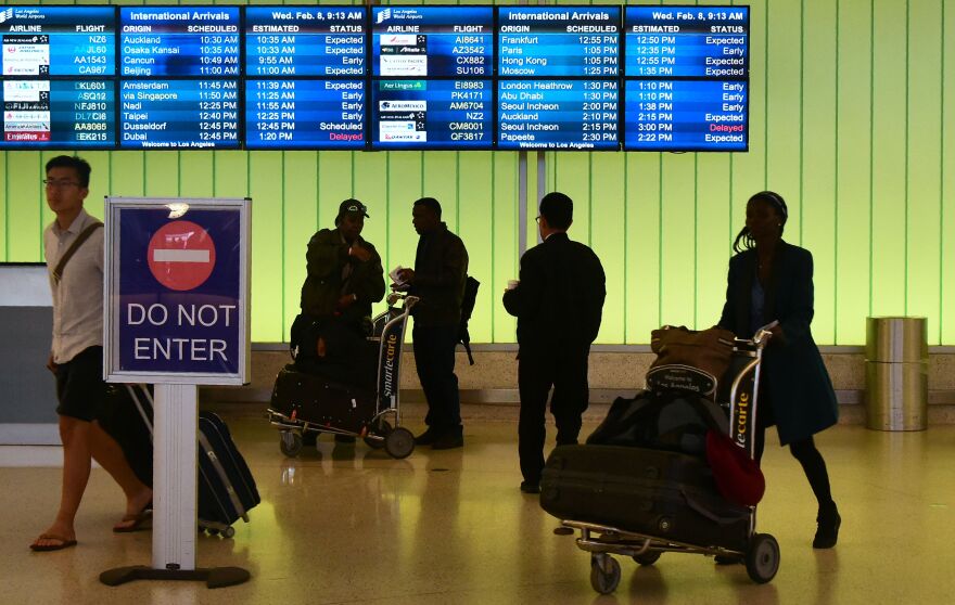 People arrive at the international terminal of Los Angeles International Airport on February 8, 2017 in Los Angeles, California. 
An appeals court weighing whether to reinstate President Donald Trump's executive order closing US borders to refugees and nationals from seven Muslim-majority countries said it did not plan to hand down its ruling on Wednesday. "The court will not be issuing a decision today," said David Madden, spokesman for the Ninth Circuit Court of Appeals in San Francisco, adding that an advance notice of 30 to 90 minutes would be given when a decision is imminent.
 / AFP / Frederic J. Brown        (Photo credit should read FREDERIC J. BROWN/AFP/Getty Images)