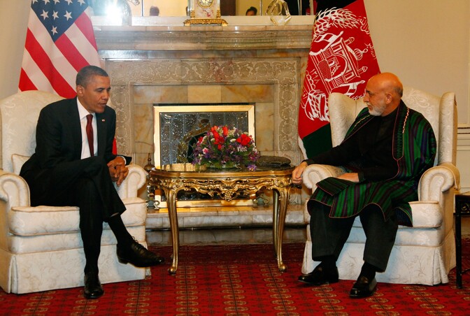 KABUL, AFGHANISTAN - MAY 02:  In handout image released by the Afghan Presidents Office, US President Barack Obama (L) attends a meeting with Afghanistan President Hamid Karzai (R), on May 2, 2012 in Kabul, Afghanistan. The US and Afghan Presidents signed a long-term strategic partnership outlining their cooperation following the 2014 withdrawal of NATO and allied forces. Obama made the secret visit to the country on the anniversary of Osama Bin Laden's death and made a primetime tv address to the American people from Bagram Air Base in Kabul. (Photo by Afghan Presidential Palace via Getty Images)