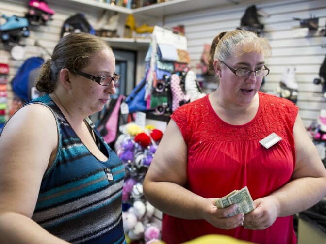 Valerie, left, and her mother Susan Woodard, the manager, work at Moonlight Rollerway in Glendale on Tuesday afternoon, June 30, 2015. Four Woodard family members work for rink owner Dominic Cangelosi. They commute together from Fontana to work at the rink. Susan Woodard has been working at a roller skating rink since she was 15.