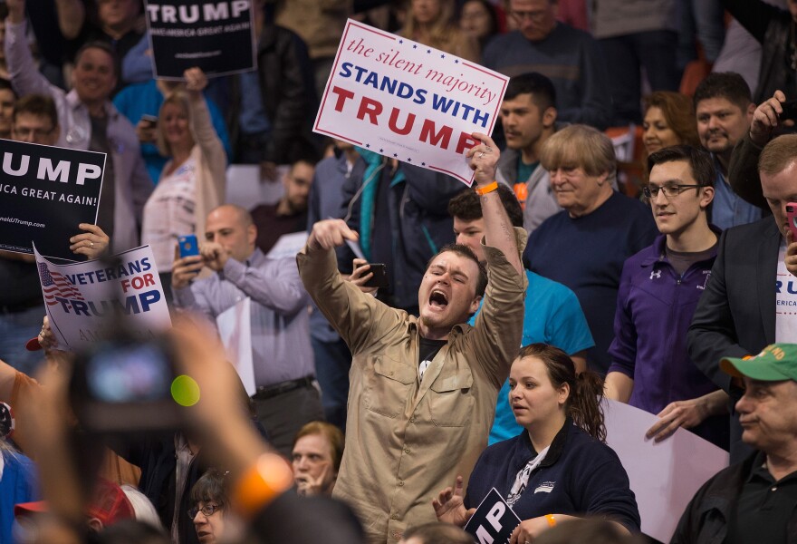 CHICAGO, IL - MARCH 11:  A supporter of Republican presidential candidate Donald Trump heckles demonstrators before the start of a rally at the University of Illinois at Chicago on March 11, 2016 in Chicago, Illinois. The campaign decided to postpone the rally, citing safety concerns, after learning hundreds of demonstrators were given tickets for the event.  (Photo by Scott Olson/Getty Images)