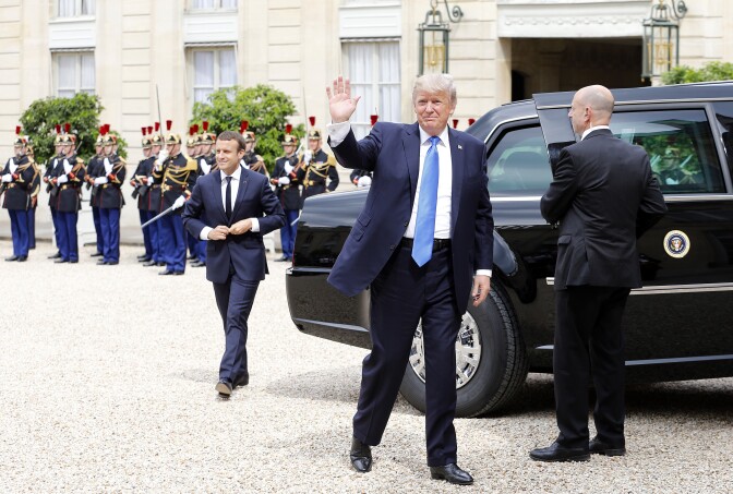 PARIS, FRANCE - JULY 13:  US President Donald Trump waves as he arrives for a  a meeting with French President Emmanuel Macron at the Elysee Presidential Palace on July 13, 2017 in Paris, France. As part of the commemoration of the 100th anniversary of the entry of the United States of America into World War I, US President, Donald Trump will attend tomorrow at the Bastille Day military parade.  (Photo by Thierry Chesnot/Getty Images)