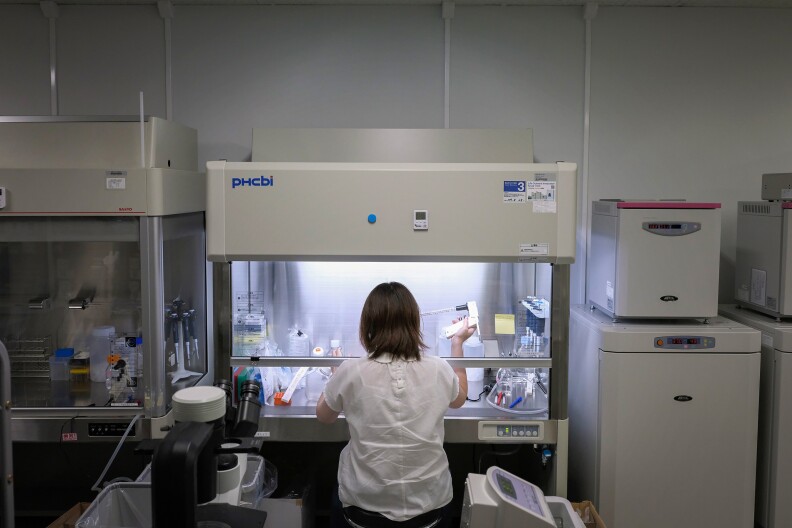A scientist at Katsuhiko Hayashi's lab at Osaka University works on IVG research. Scientists here are have already created mouse eggs using stem cells and are continuing to learn more about the process.