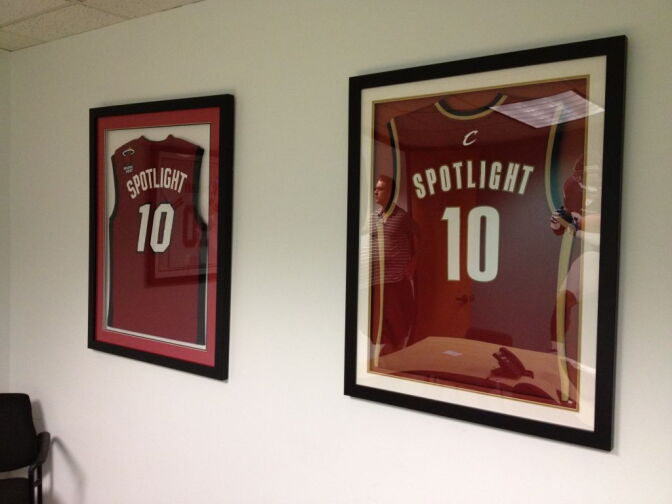 Framed Cleveland Cavaliers and Miami Heat jerseys on the wall at Spotlight TMS in Calabasas