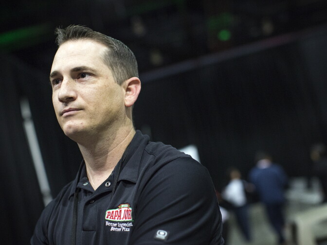 Kyle Brown is a director of operations in Los Angeles for Papa John's. Brown conducts interviews with job candidates at the Los Angeles Convention Center on Thursday morning, Feb. 11, 2016 during the Los Angeles Opportunity Hiring Fair. Brown started with the company at age 20 as a delivery driver.