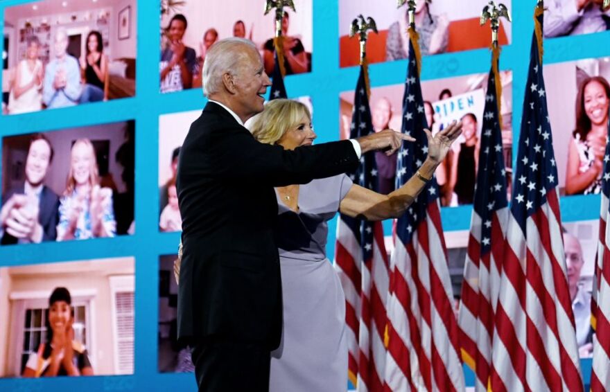 Former vice-president and Democratic presidential nominee Joe Biden and his wife Jill Biden wave to supporters watching remotely after he accepted the Democratic Party nomination for US president during the last day of the Democratic National Convention, being held virtually amid the novel coronavirus pandemic, at the Chase Center in Wilmington, Delaware on August 20, 2020. (Photo by Olivier DOULIERY / AFP) (Photo by OLIVIER DOULIERY/AFP via Getty Images)