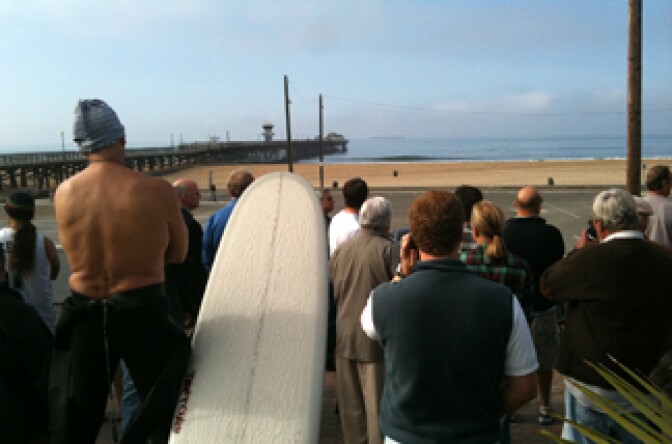 Crowds of 100 plus wait for a surge in Seal Beach on Friday, March 11, 2011, after a tsunami warning along the California coast was called. It was triggered by a ferocious tsunami that spawned by one of the largest earthquakes ever recorded on Japan's eastern coast. The tsunami killed hundreds of people as it swept away boats, cars and homes while widespread fires burned out of control.