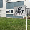 A "for rent" sign hangs outside a Los Angeles apartment building. 