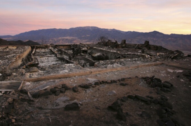 Daybreak reveals the ruins of a home destroyed in the deadly 40,000-acre Esperanza Fire in the San Jacinto Mountains on October 28, 2006 west of Palm Springs near Banning, California.