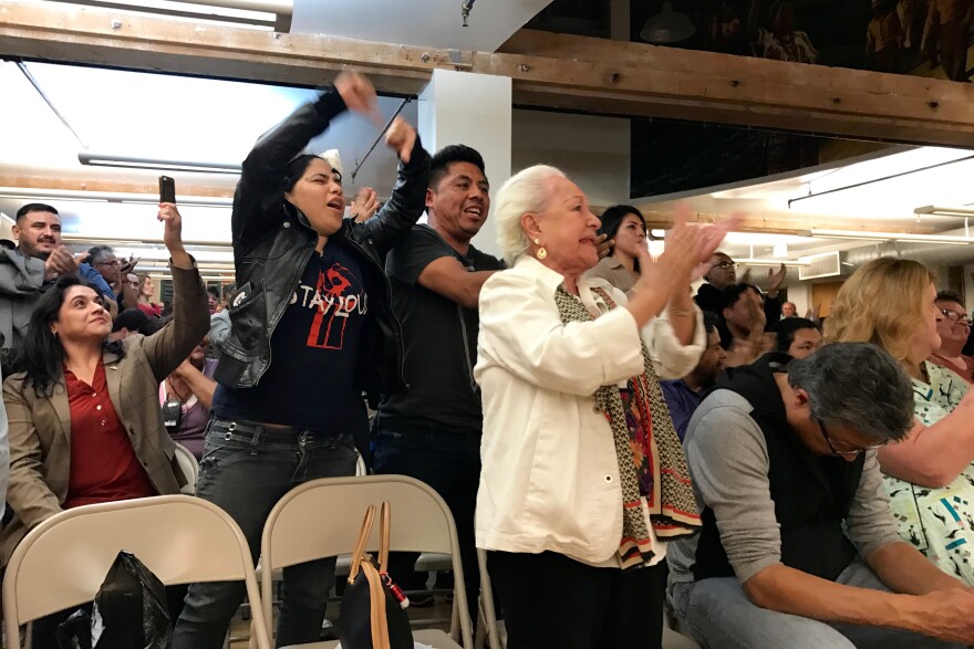 The audience erupts during a debate between City Council member Gil Cedillo and challenger Joe Bray-Ali on April 17, 2017.