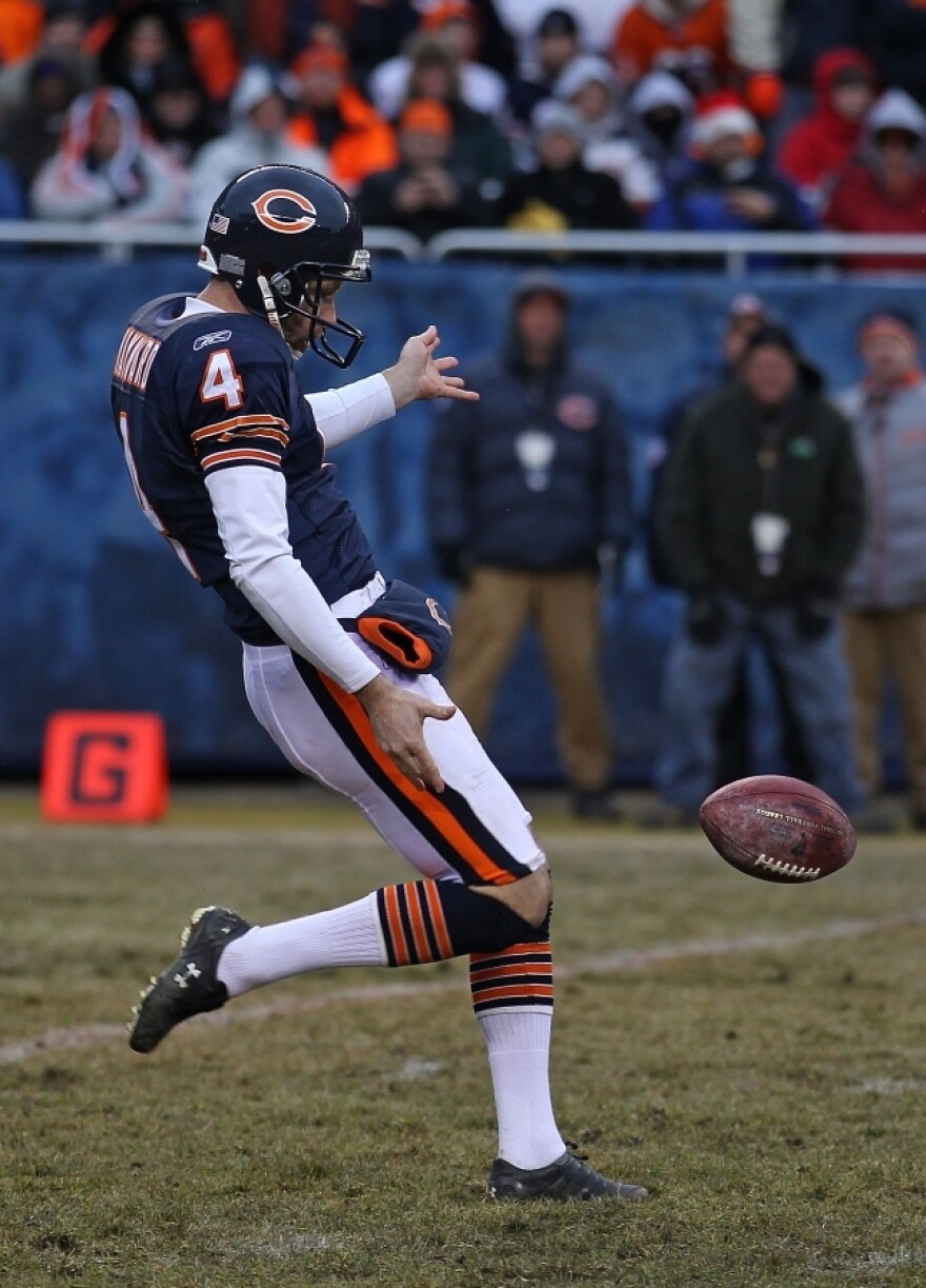 Brad Maynard of the Chicago Bears punts the ball against the New York Jets on Dec. 26 at Soldier Field in Chicago. The authors of <em>Scorecasting </em>say statistics show that running a play on fourth down instead of punting can be more effective at getting points, contrary to common belief.