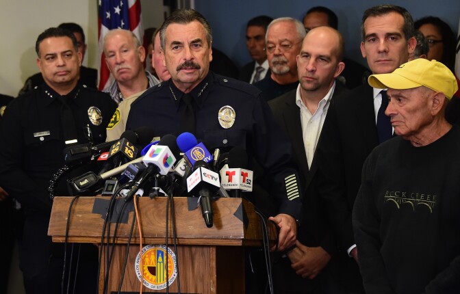 Los Angeles police chief Charlie Beck addresses the media at Los Angeles Unified School District headquarters where schools superintendant Ramon Cortines, mayor Eric Garcetti and police chief Beck addressed the media in Los Angeles, California on December 15, 2015. The city of Los Angeles shut down all public schools on Tuesday after receiving a "credible" electronic threat targeting the country's second-largest education district and its 640,000 students. Ramon Cortines, the superintendent of Los Angeles schools, said the extraordinary measure was ordered as a precaution, triggered in part by the December 2 attacks in nearby San Bernardino. AFP PHOTO/ FREDERIC J. BROWN / AFP / FREDERIC J. BROWN        (Photo credit should read FREDERIC J. BROWN/AFP/Getty Images)