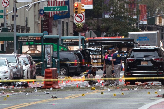 NEW YORK, NY - SEPTEMBER 18: FBI agents review the crime scene of remnants of bomb debris on 23rd St. in Manhattan's Chelsea neighborhood on September 18, 2016 in New York City. An explosion that injured 29 people that went off in a construction dumpster is being labeled an "intentional act". A second device, a pressure cooker, was found four blocks away that an early investigation found was likely also a bomb. (Photo by Stephanie Keith/Getty Images)