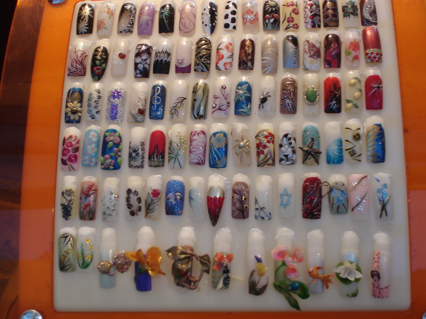 Wall of acrylic nails.